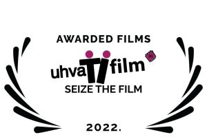 Između 2 venčića (simbol za nagradu) logo Uhvati fil, ispod piše Best films, Seize the film, 2022